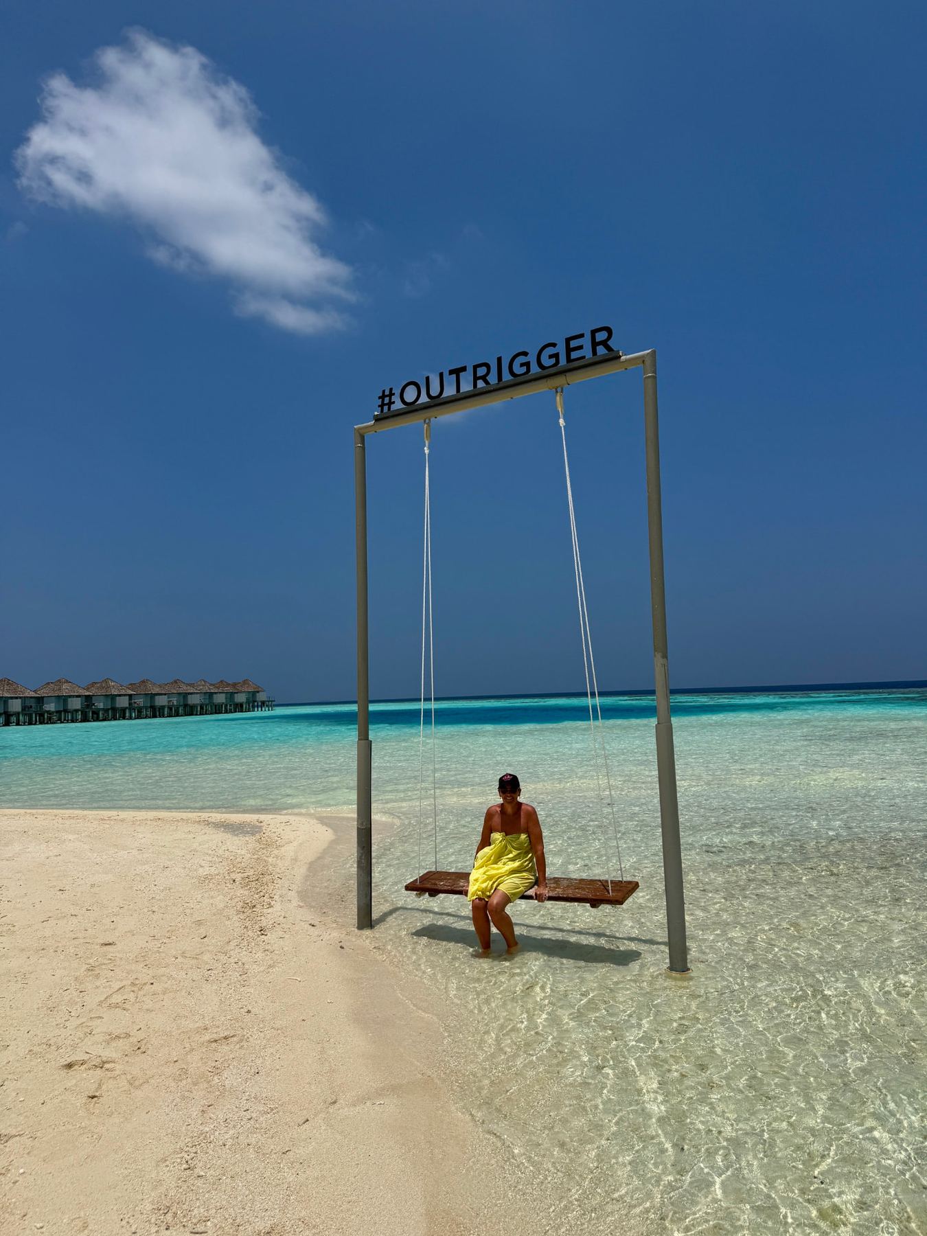Swing set in the shallow lagoon off a Maldivian sandbar