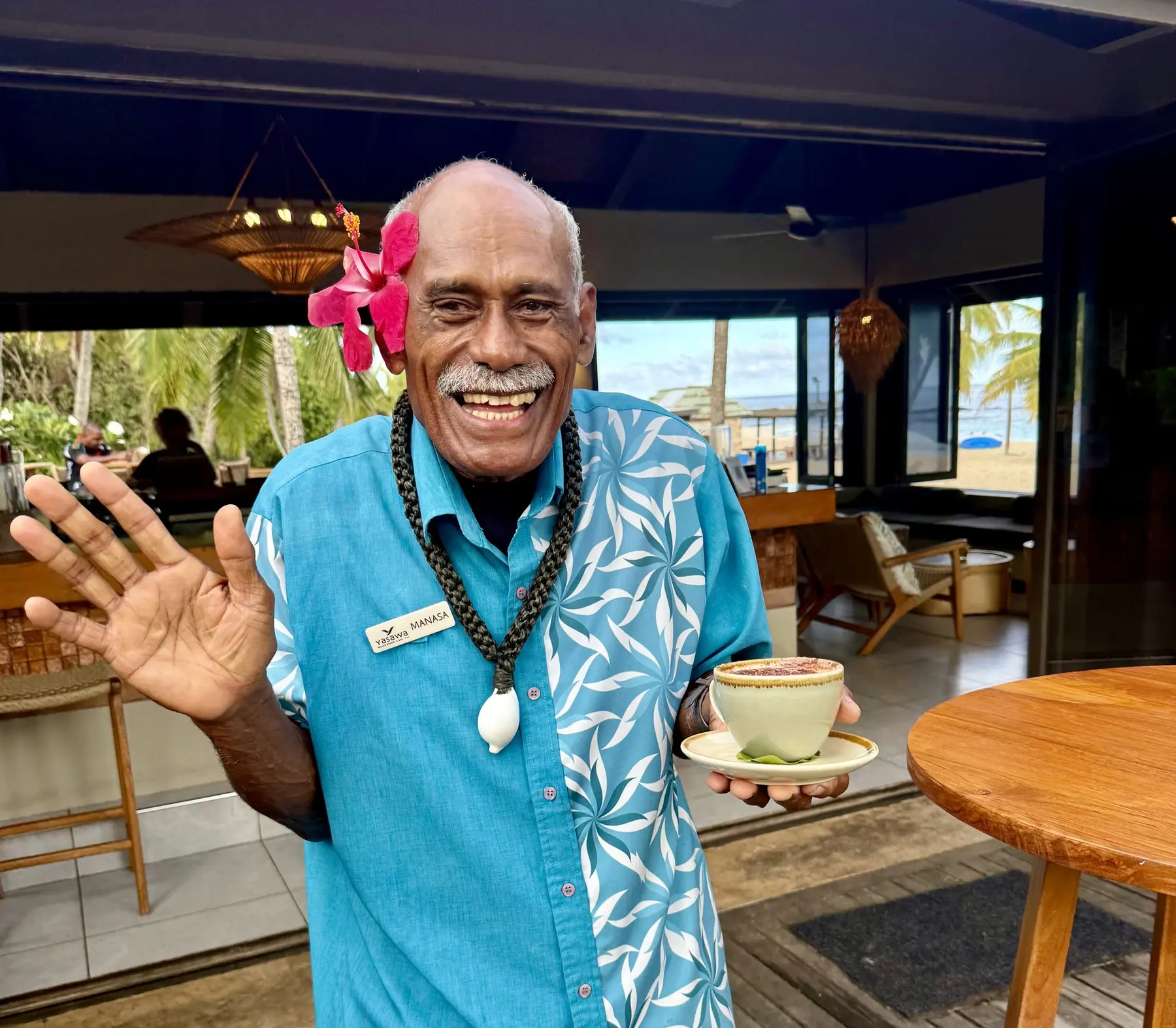 Yasawa Island Resort staff member welcoming guests